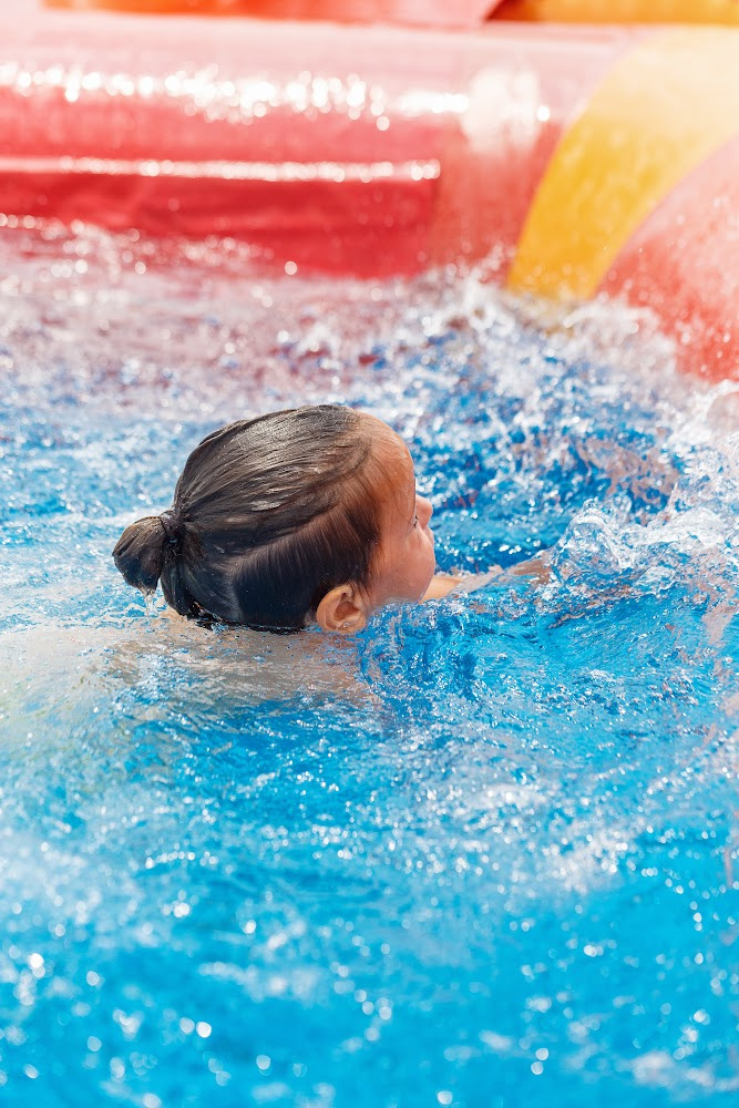Kid playing in the pool at the after school program at River City Preschool Kid playing in the pool at the after school program at River City Preschool