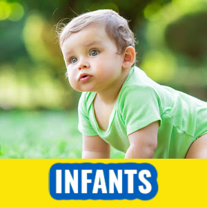 Infant crawling in the grass