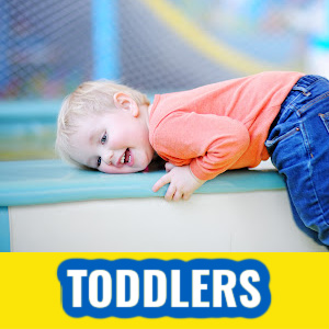 Toddler laying on a playset
