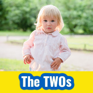 Two year old girl playing outside