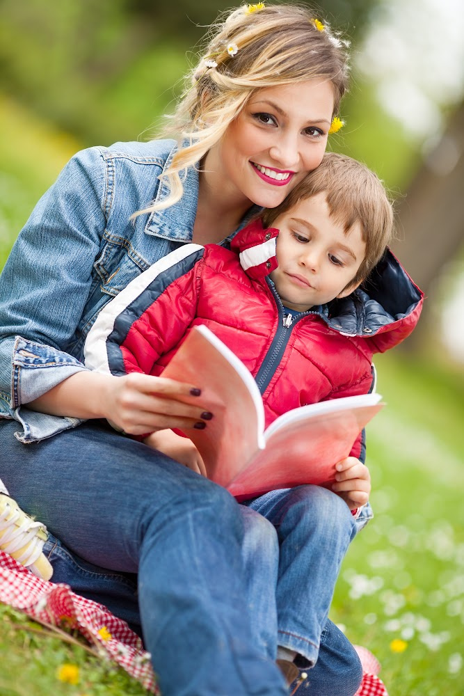 Woman reading to her child Woman reading to her child
